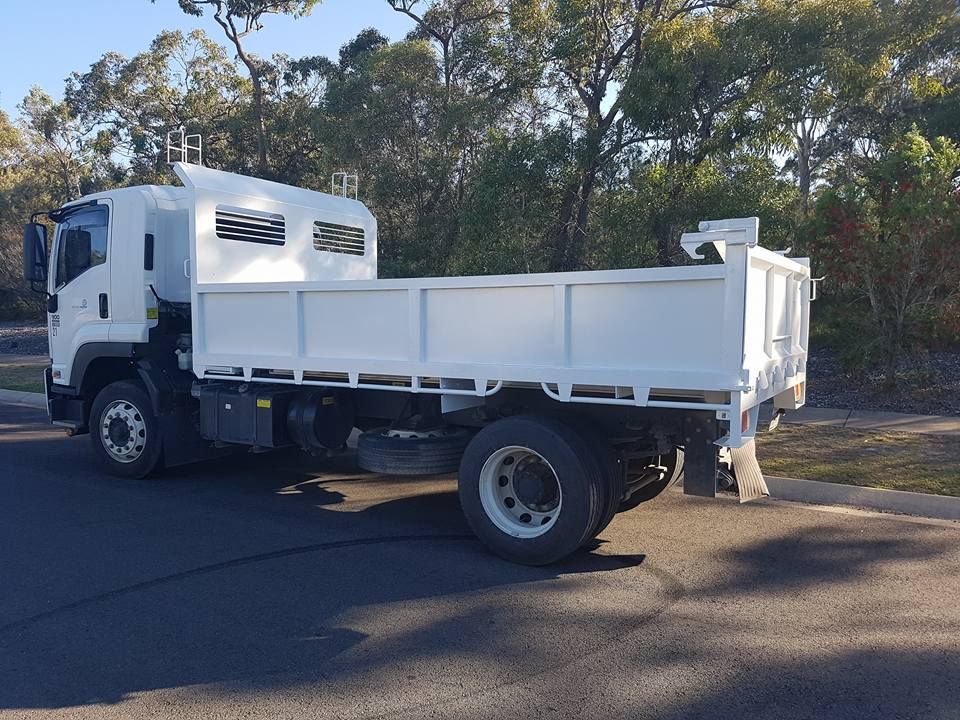 White Dump Truck Parked on an Asphalt Road — R&B Automotive PTY LTD In Urangan, QLD