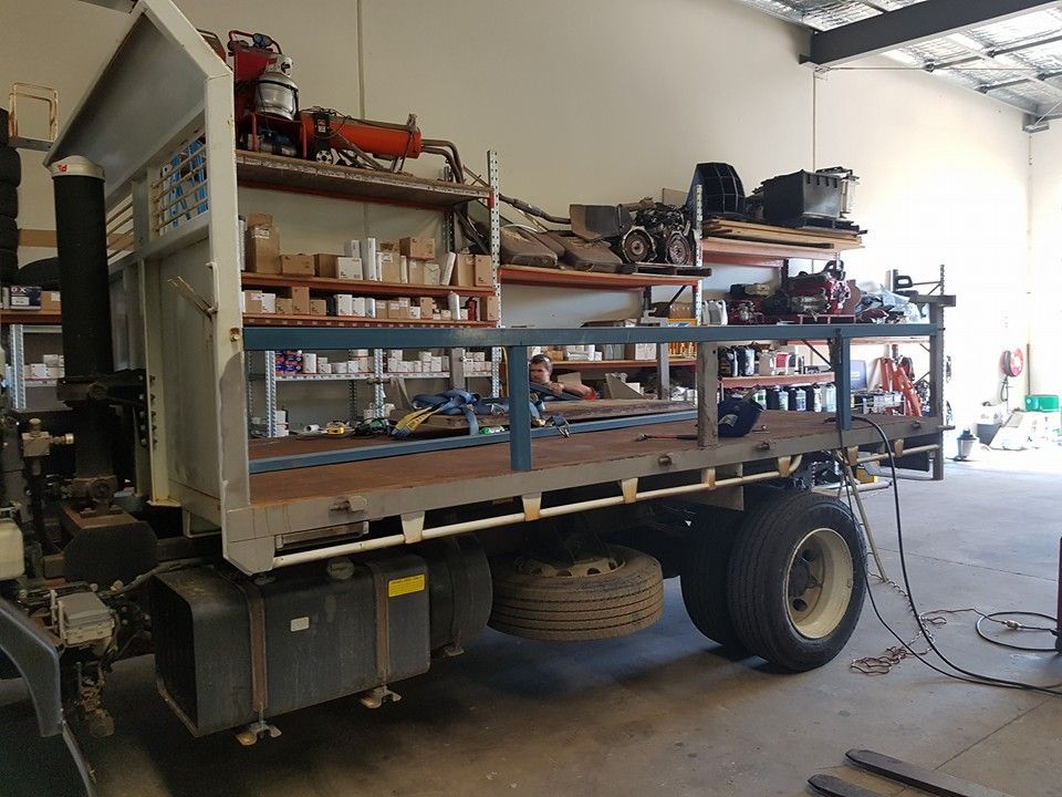 A Utility Truck With Shelves Loaded With Tools and Parts Inside a Workshop — R&B Automotive PTY LTD In Urangan, QLD