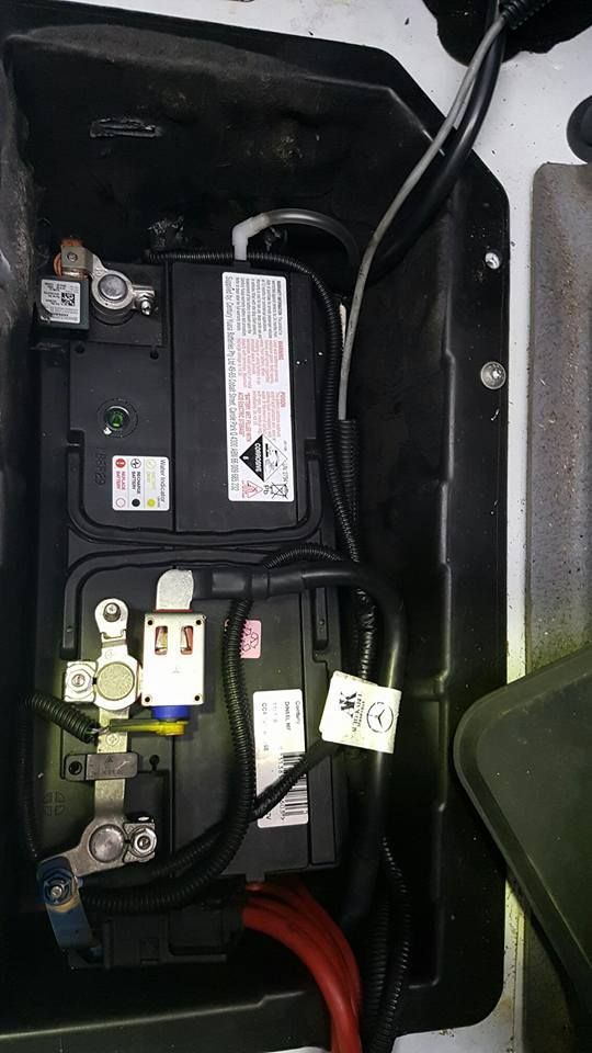 Two Car Batteries in a Black Compartment With Cables and Terminals — R&B Automotive PTY LTD In Toogoom, QLD