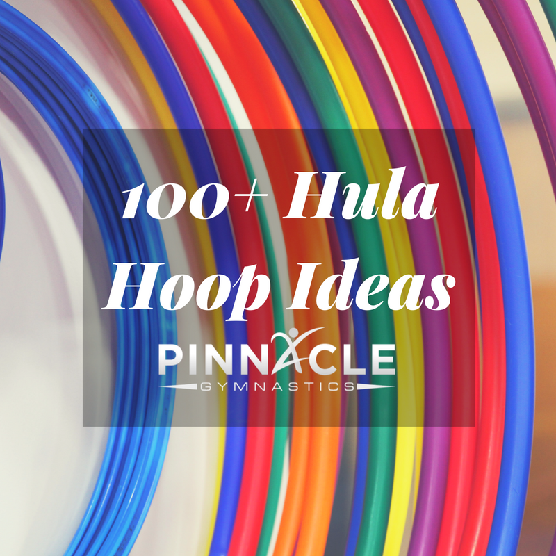 colorful hula hoops hanging from a wall in a gym