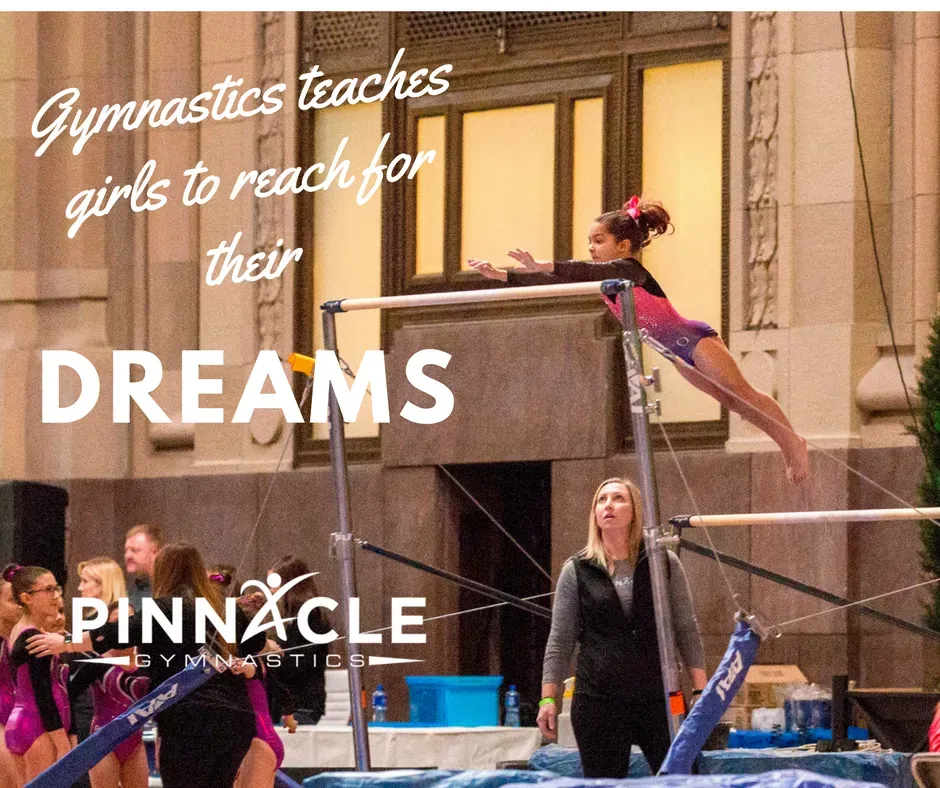 A Gymnast jumping from the low bar to the high bar.