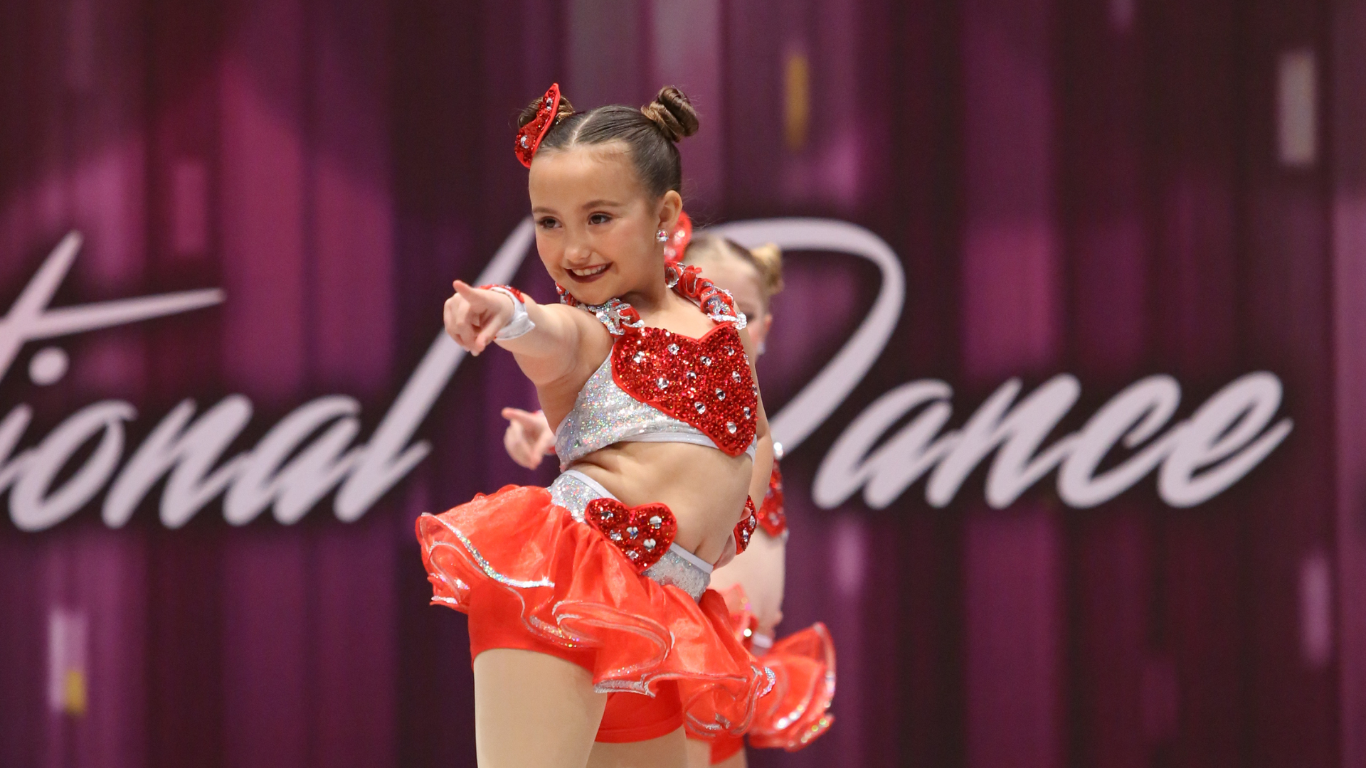 dancer on stage at the recital performing a jazz routine