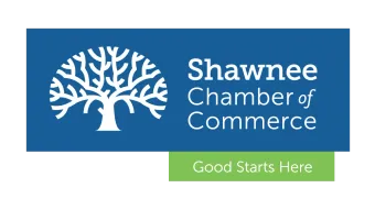 The logo for the shawnee chamber of commerce has a tree on it.