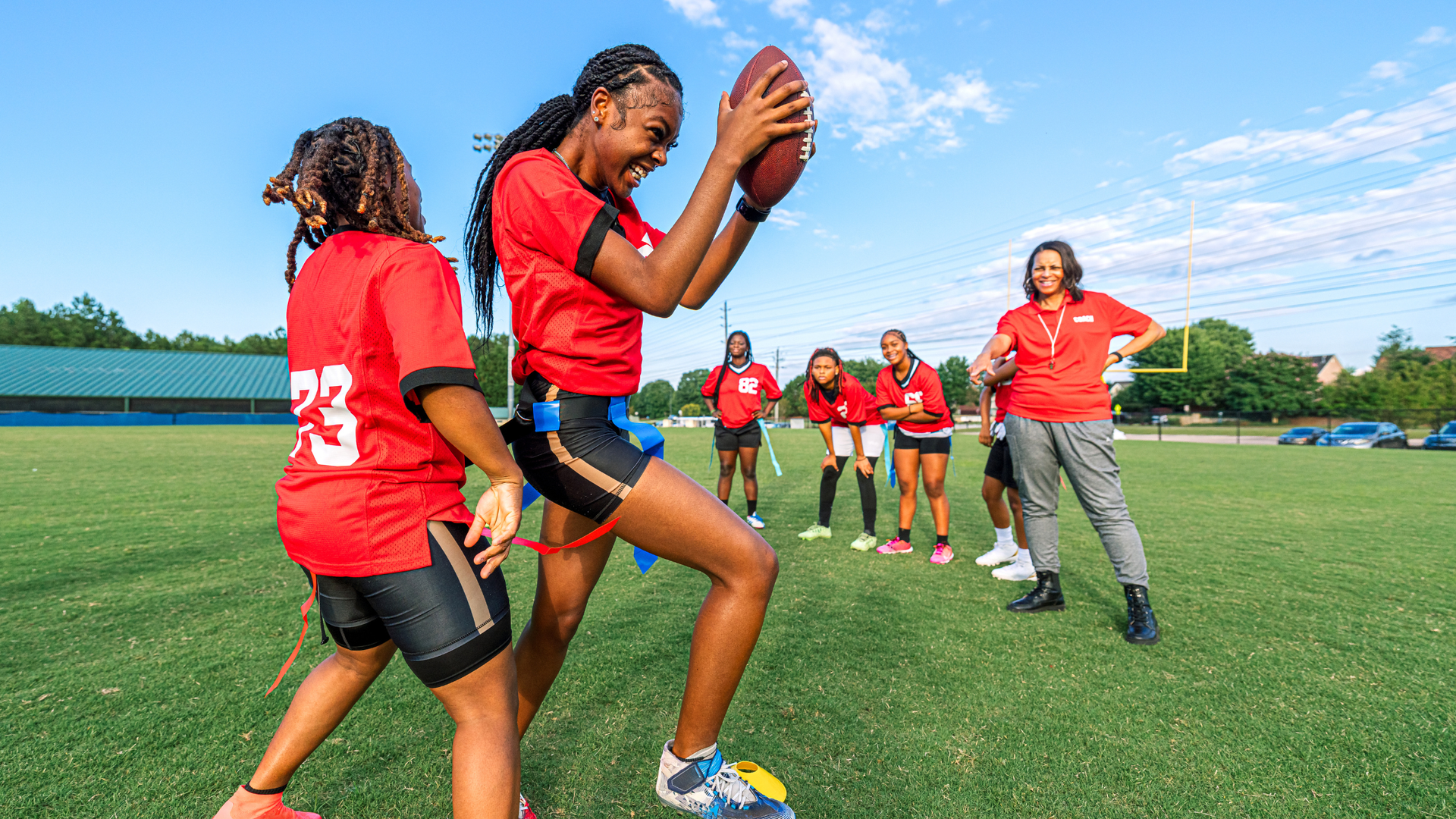 two girls celebrating a flag football success