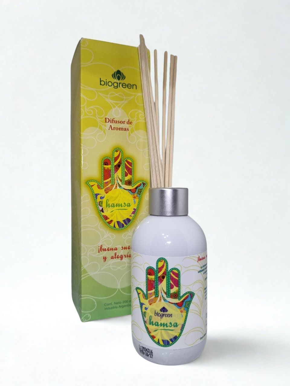 Frasco de aceite esencial con varillas difusoras y empaque verde-amarillo 