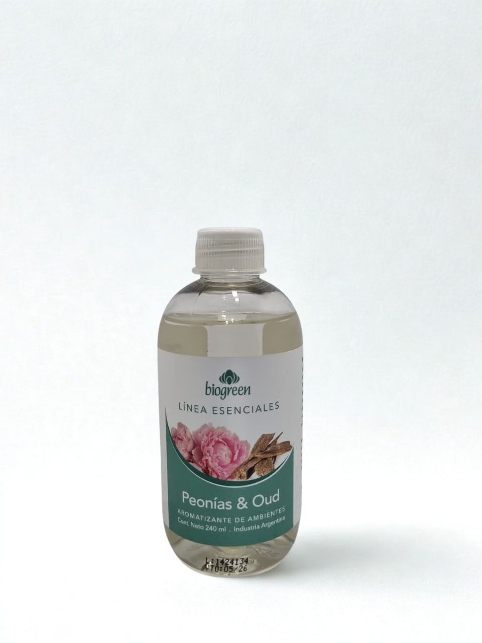Frasco pequeño y transparente de gel de ducha con aroma a peonías rosas 