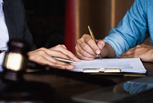 Divorce Agreement — Executive Hands Signing Contract in Victoria, TX