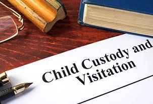 Child Visitation — Child Custody and Visitation Written on a Paper in Victoria, TX