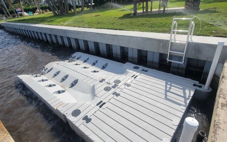 A floating dock with a ladder attached to it is in the water.