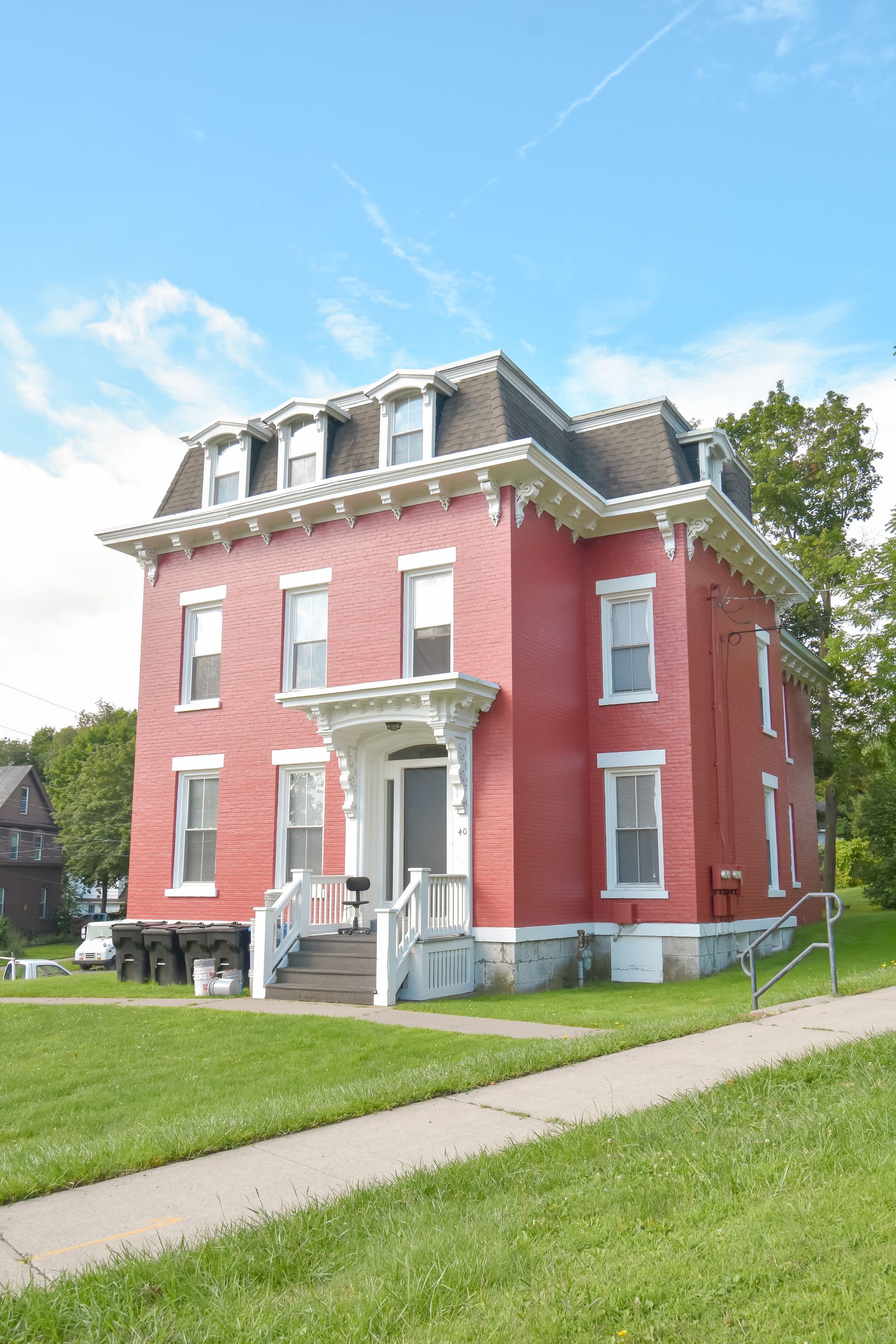 40 Prospect  – Large red brick historic-style building with decorative white trim and front steps.