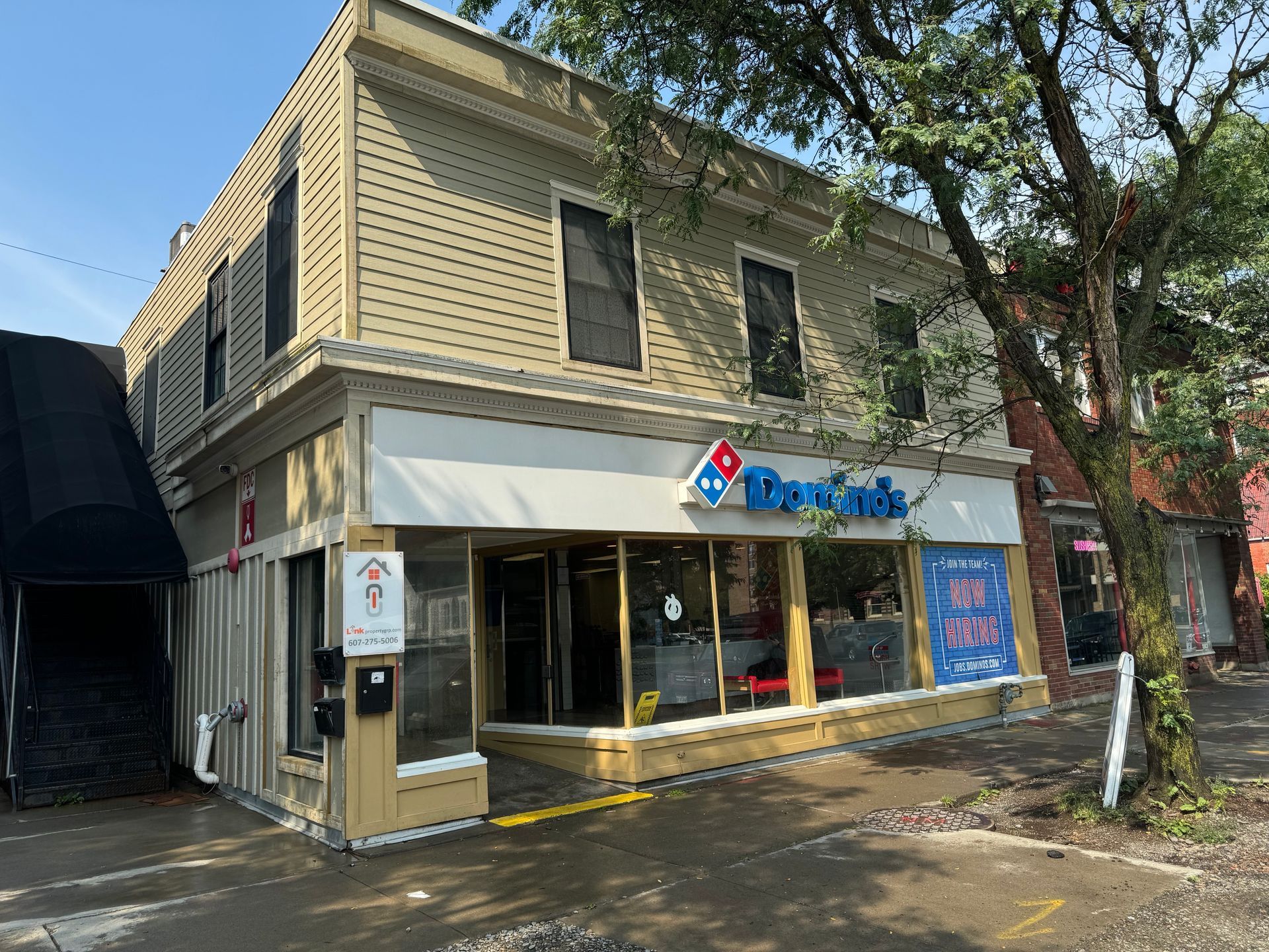 8 Court Street – Two-story tan building with a Domino’s storefront on the ground level, located on Court Street.