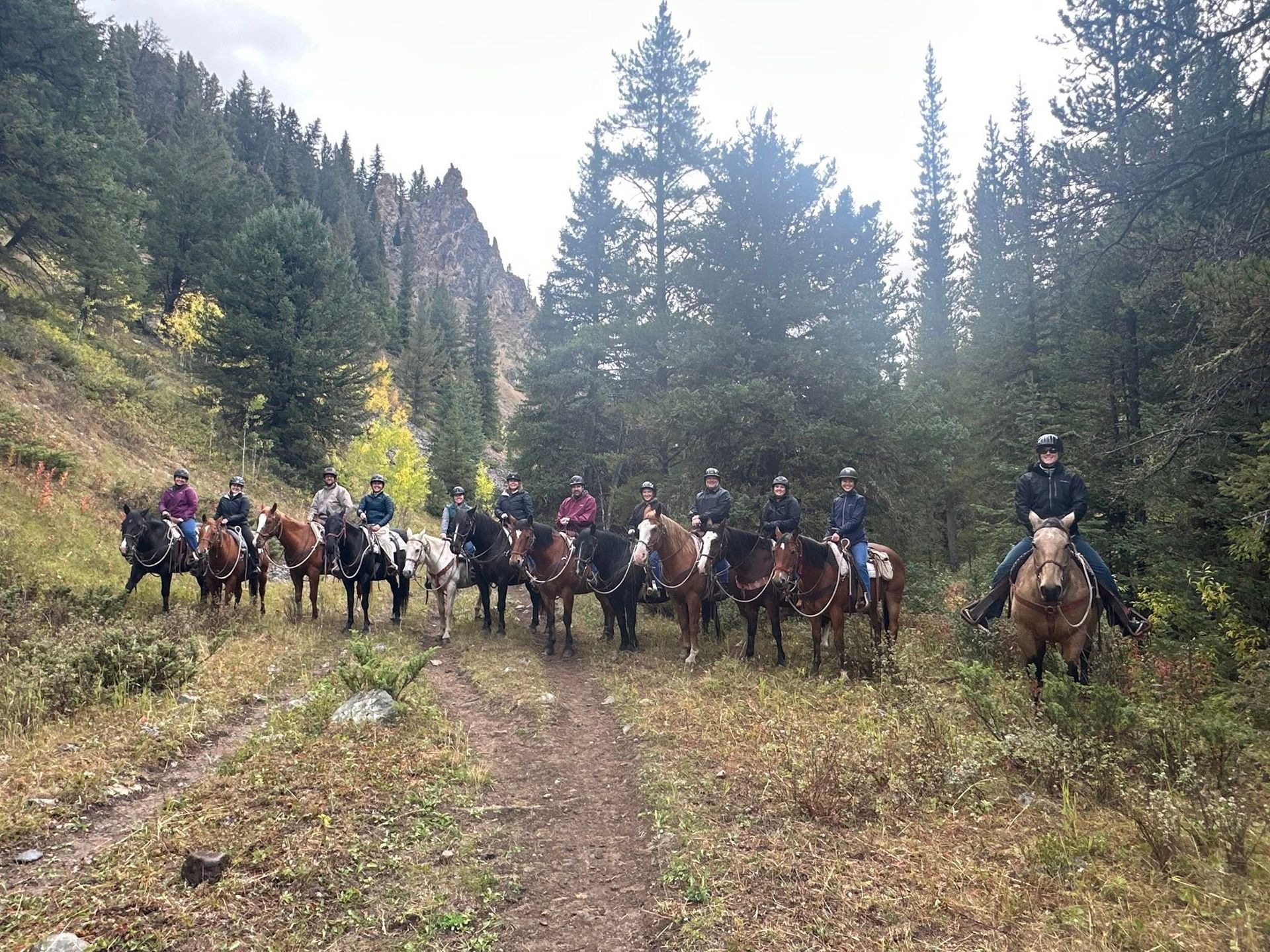 Decade One participants on a trail ride in Montana