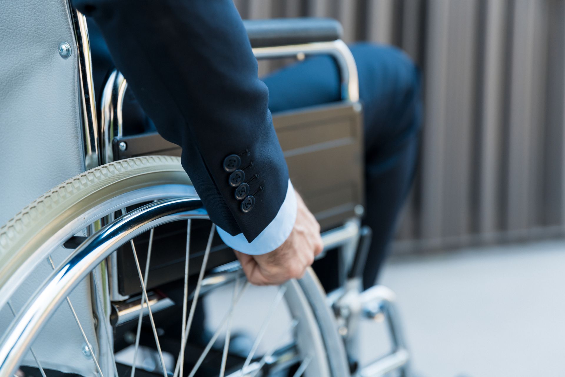 Businessman in wheelchair at office showing Social Security Disability Lawyer support and care. Businessman in wheelchair at office showing Social Security Disability Lawyer support and care.