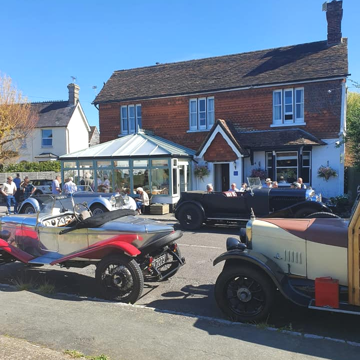 Car raleigh outside Crown Inn Dial Post village green pub