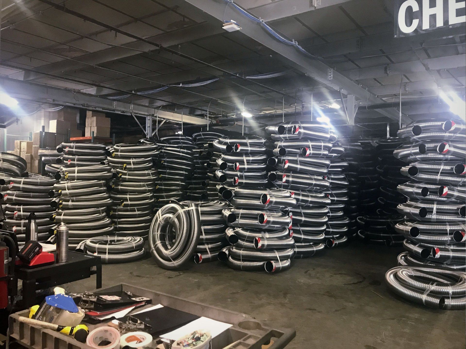 A warehouse filled with lots of tires stacked on top of each other.