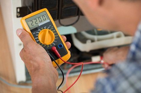Repairman Checking Fridge With Digital Multimeter - Kallangar, QLD - The Chill Dude
