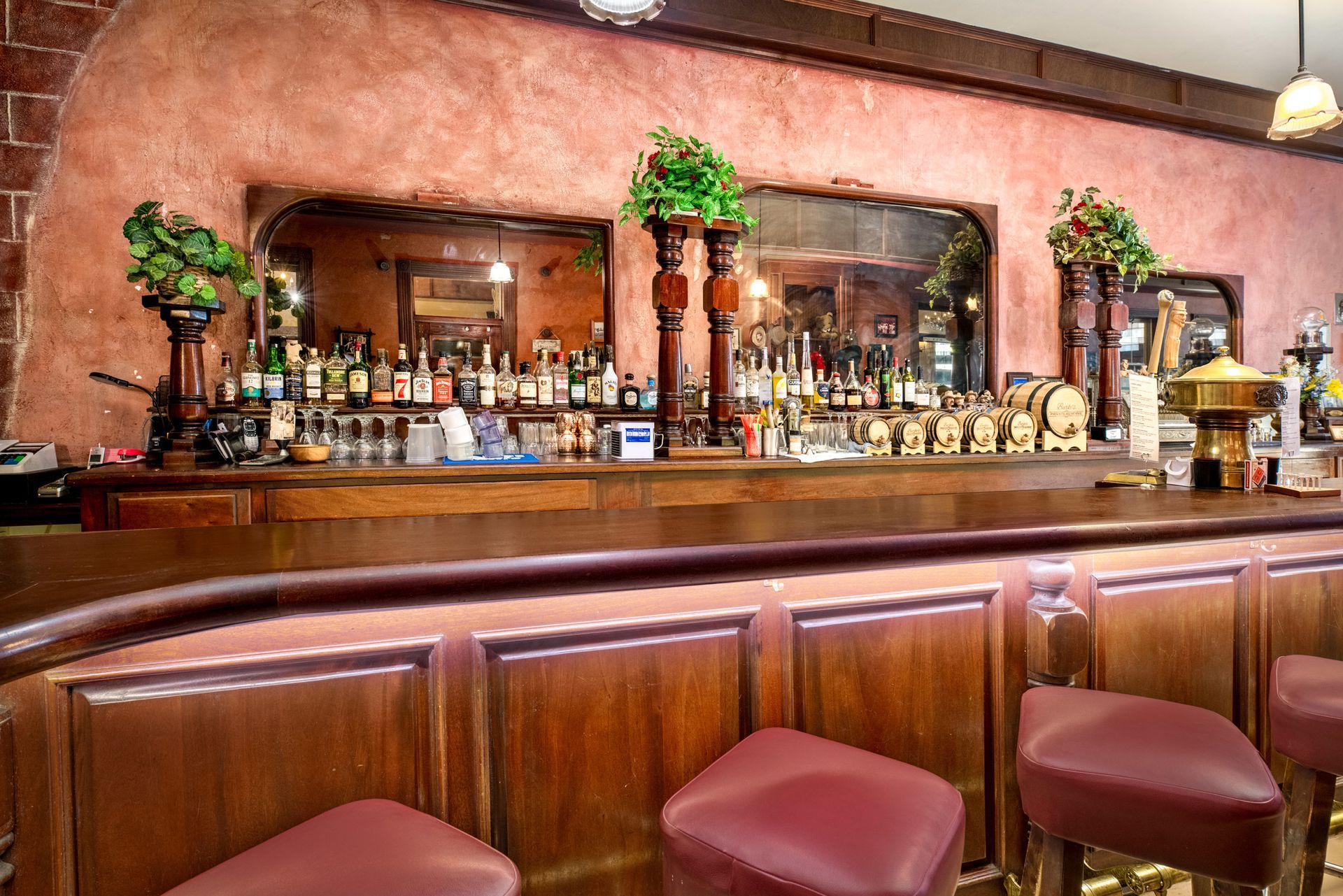 A bar with a lot of bottles on it