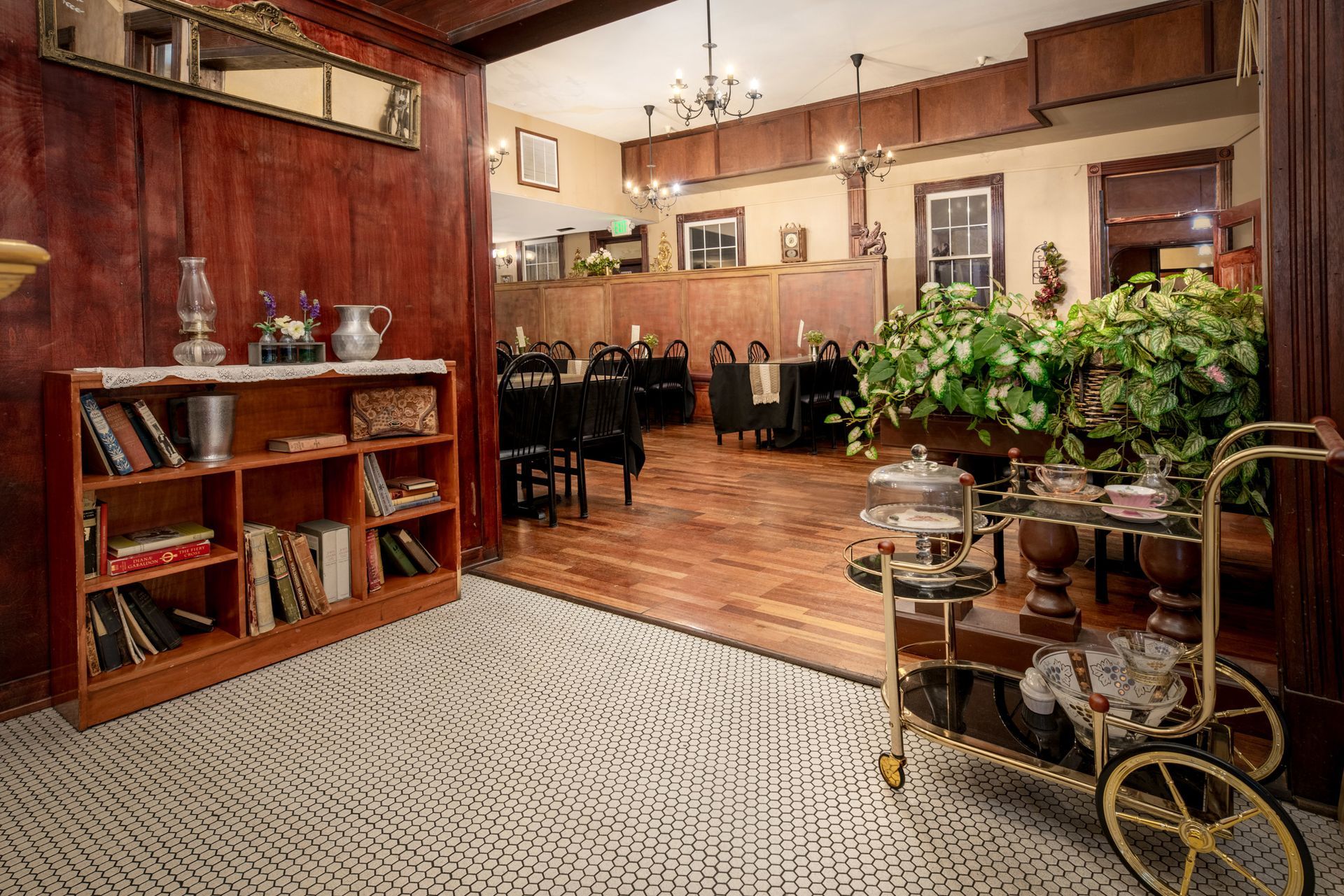 There is a bar cart in the middle of the room.