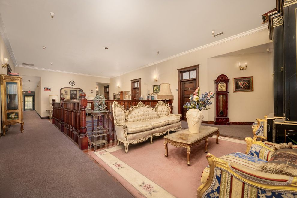 A living room filled with furniture and a clock.
