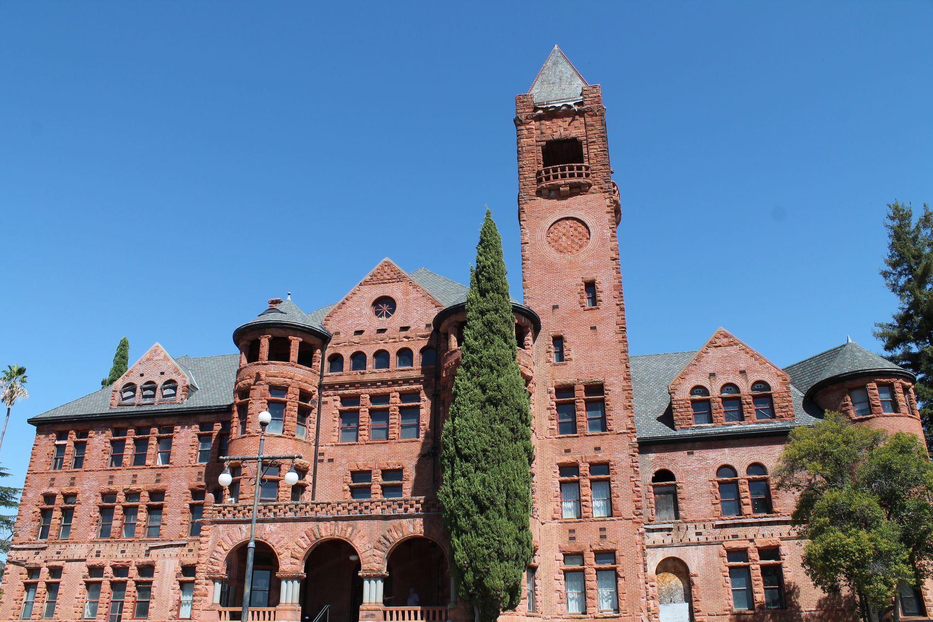 A large brick building with a clock tower on top of it