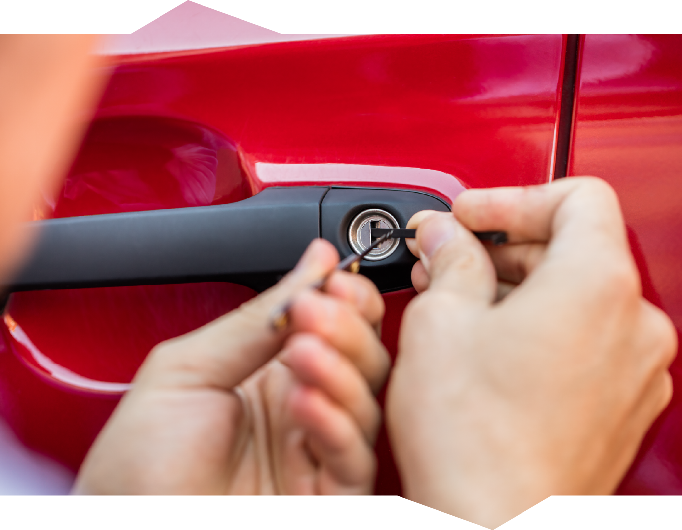 A person is opening a car door with a key.