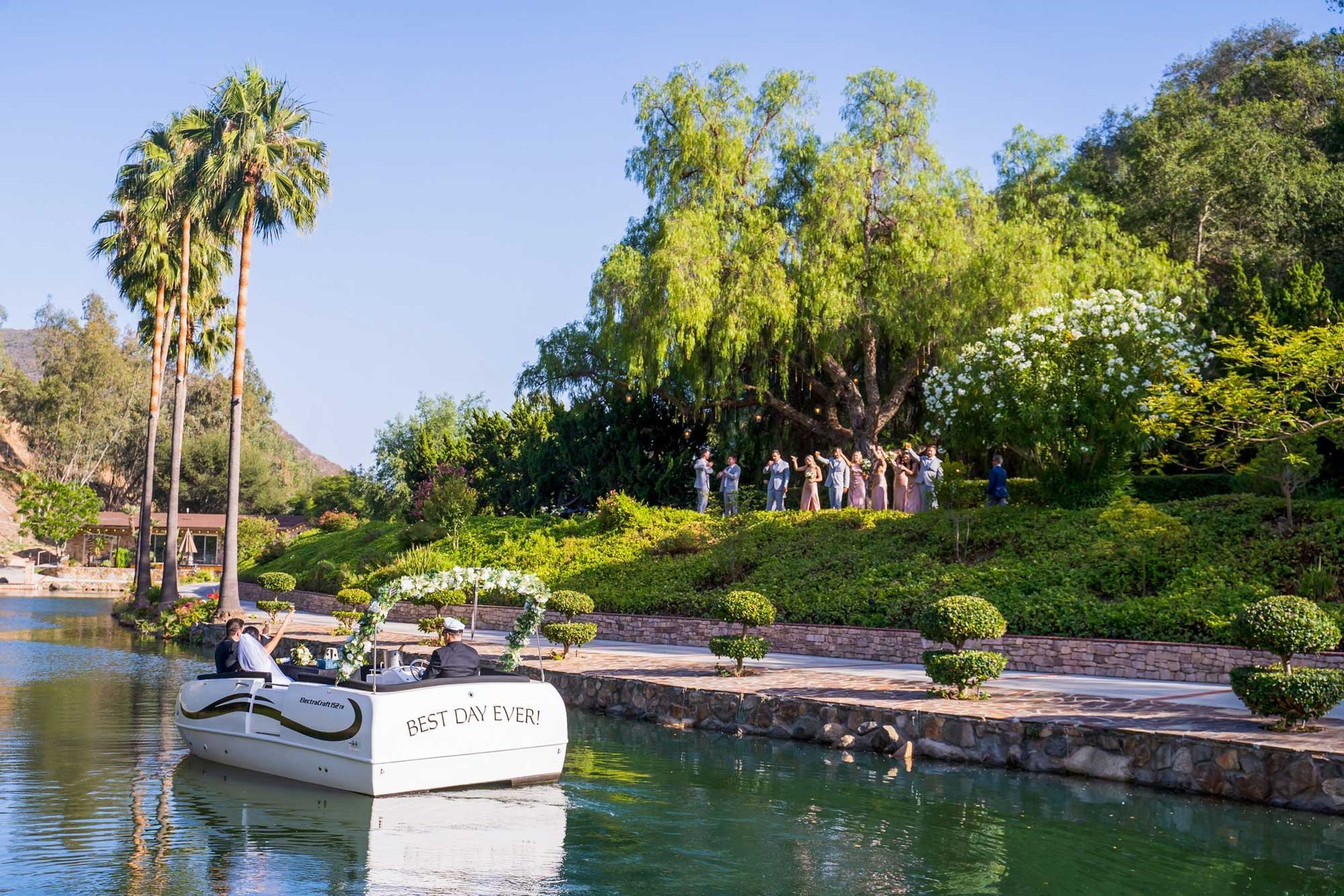 A boat is floating on a river in a park.