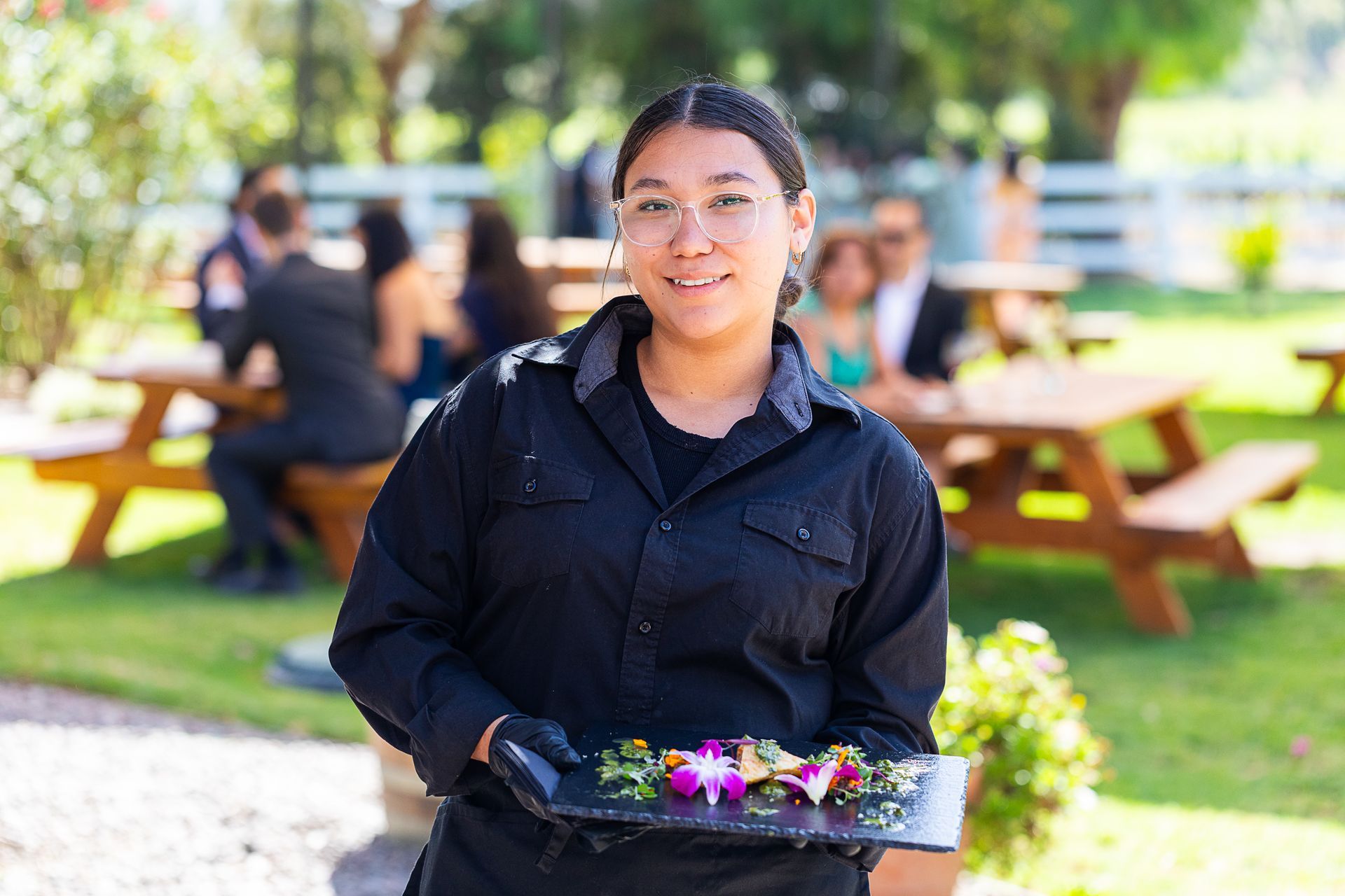 catering server holding appetizers