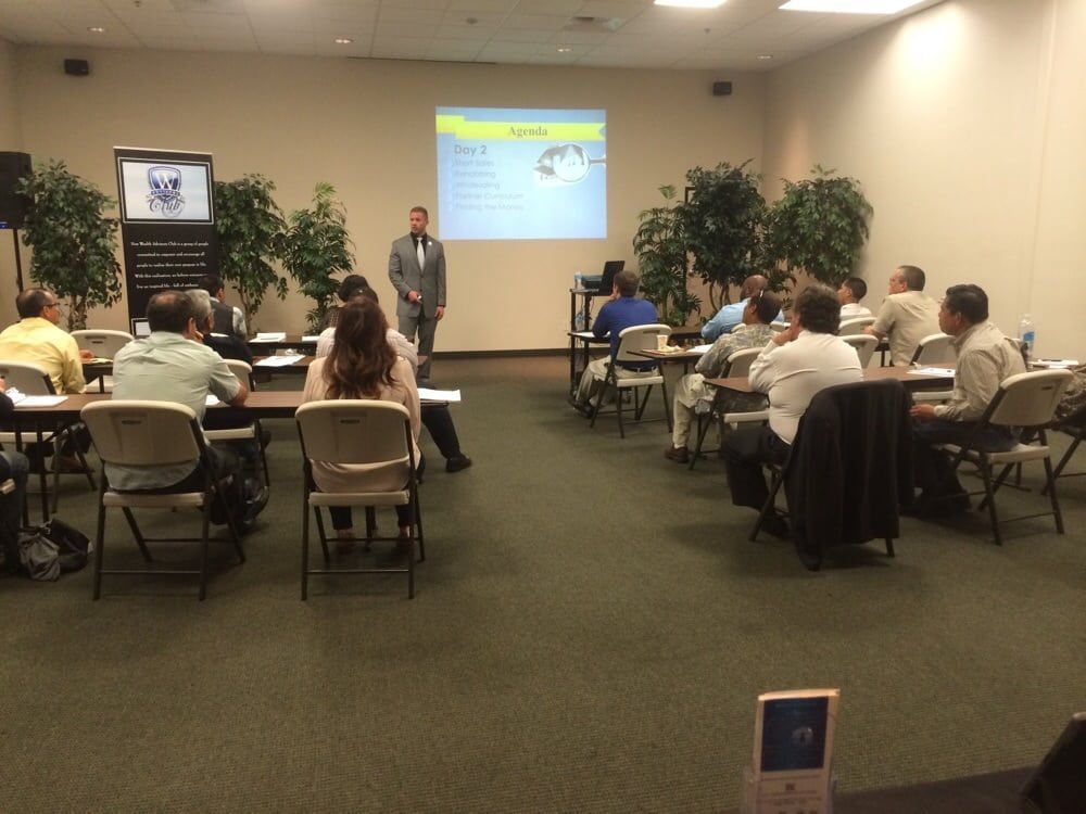 A man is giving a presentation to a group of people