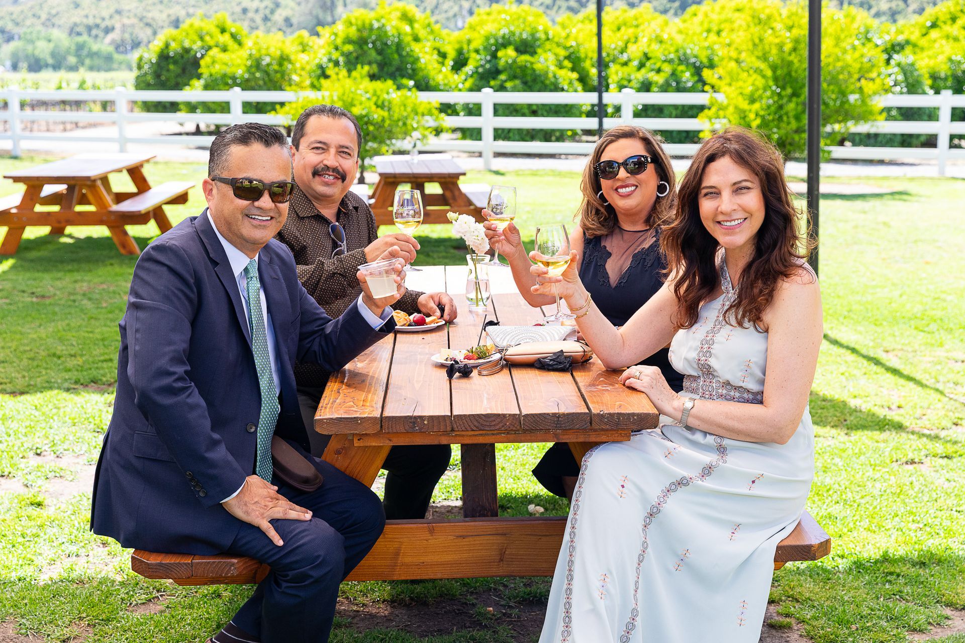wedding guests at picnic table