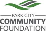 Logo for Park City Community Foundation: Green and gray stylized waves above text.