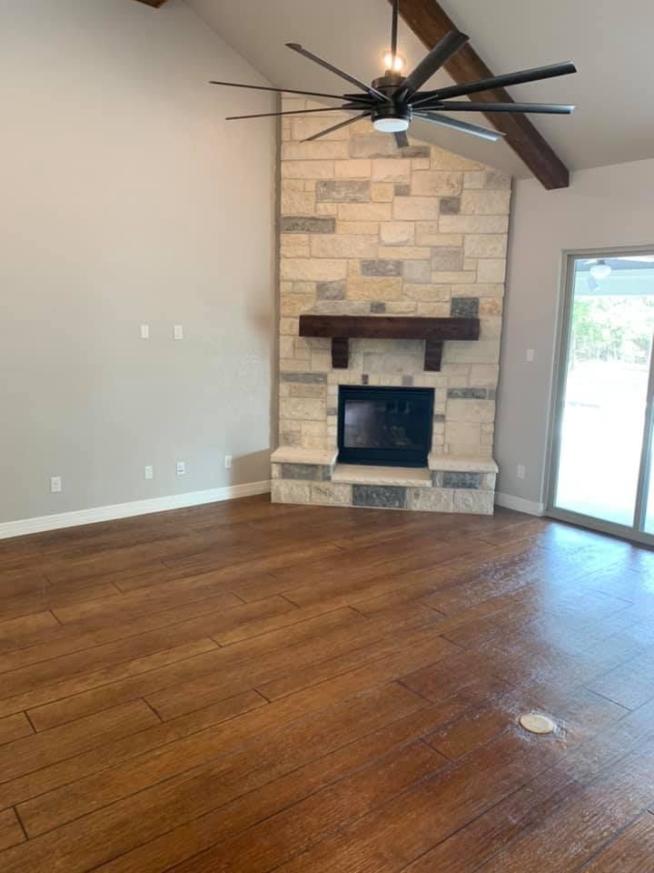 A man wearing a mask is carrying a cardboard box into a van.