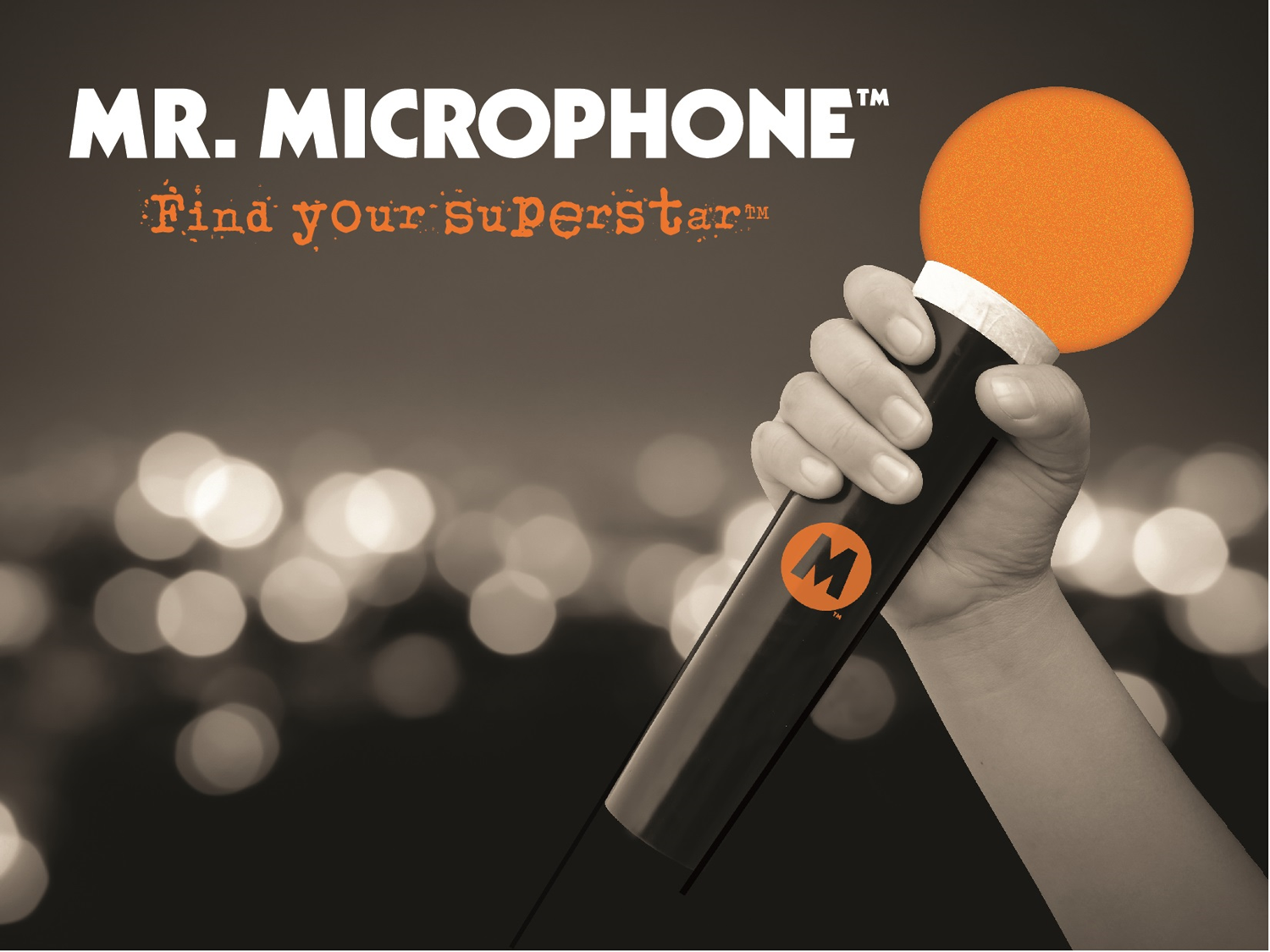Hand holding a lit-up orange microphone with logo