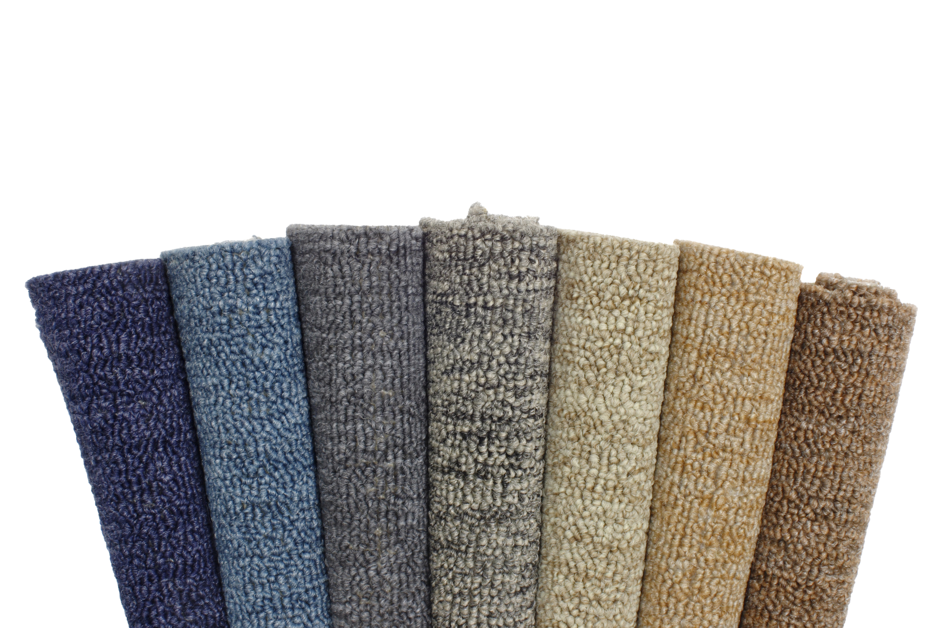 Rolled-up carpet samples in various shades of blue, gray, tan, and brown, arranged side by side.