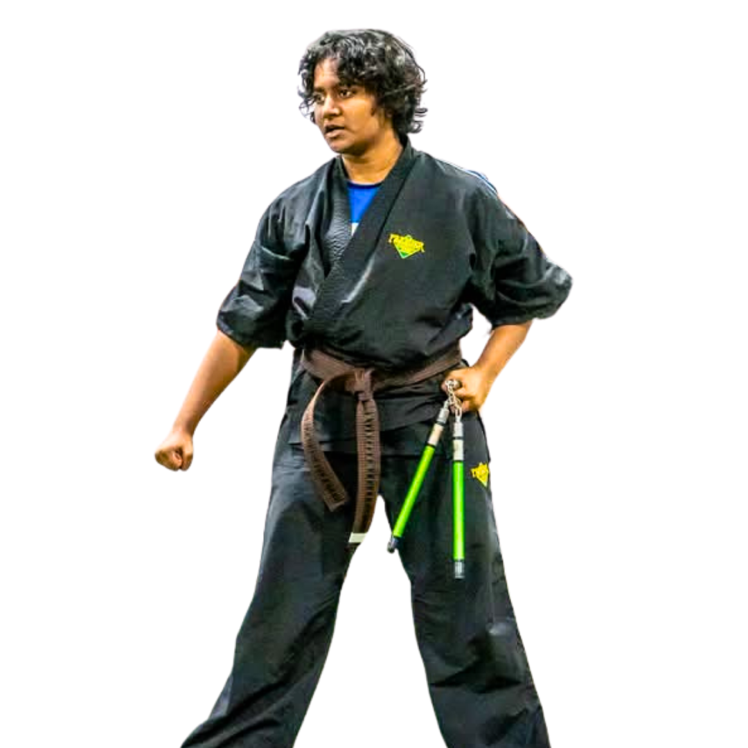 A boy and a girl are practicing karate with black belts