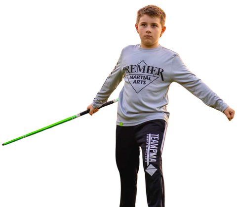 a group of children are practicing martial arts together .