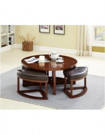 A round coffee table with stools underneath it