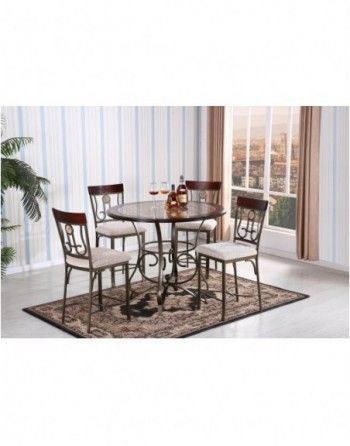 A dining room with a table and chairs and a rug.