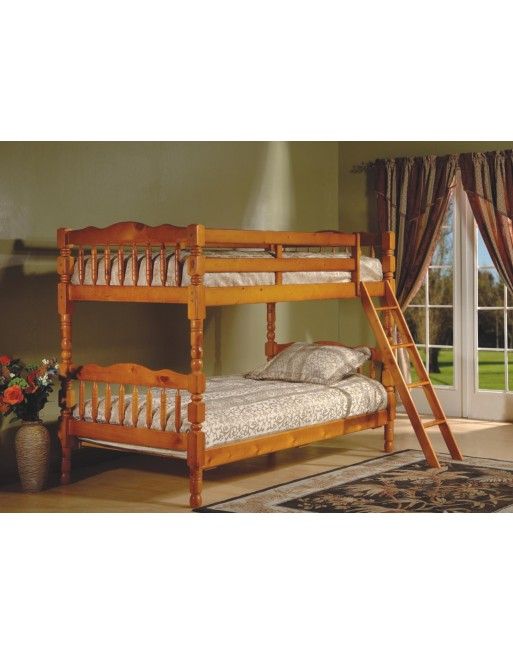 A wooden bunk bed with a ladder in a bedroom next to a window.