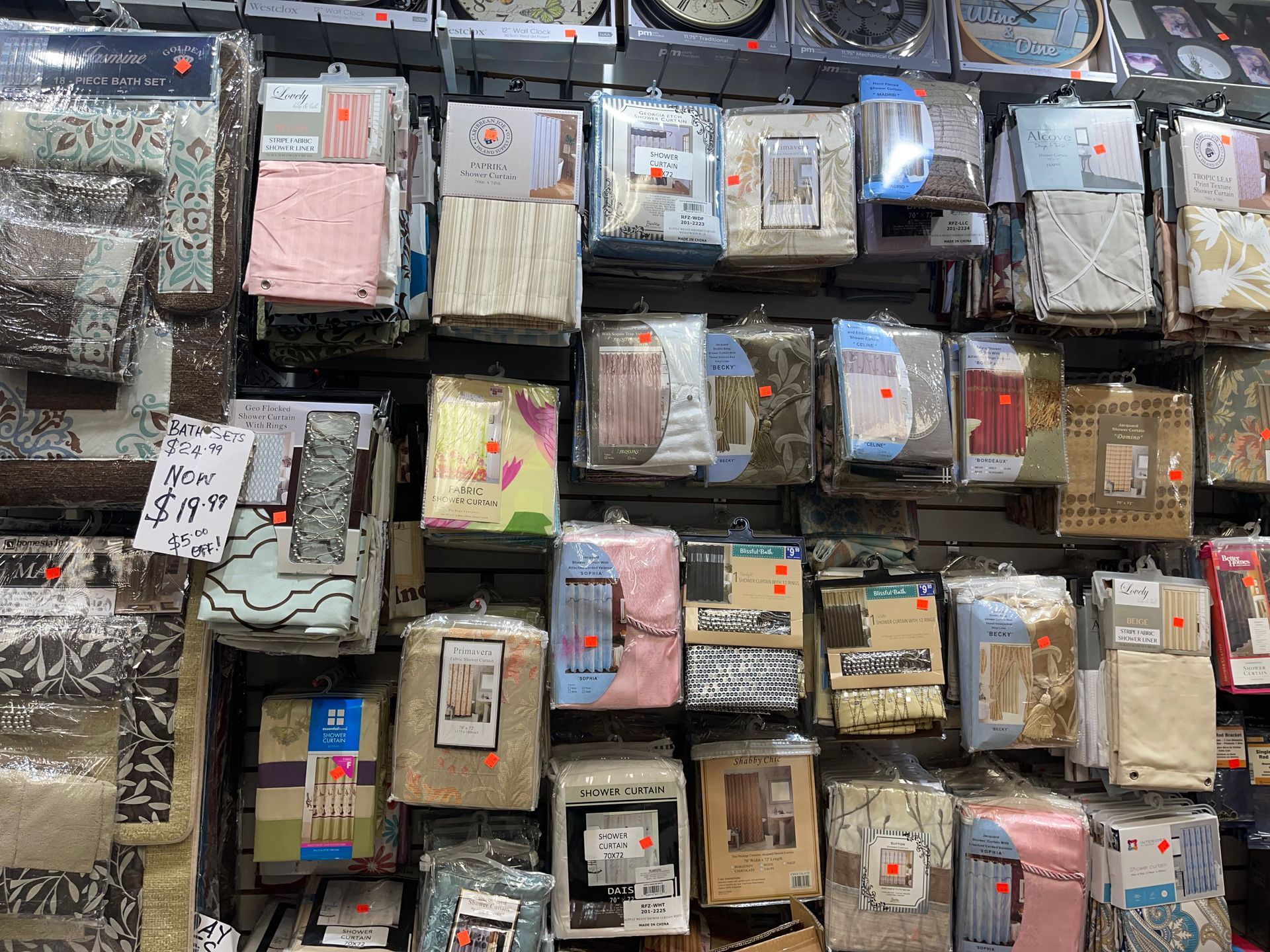 A wall filled with lots of different types of bedding.