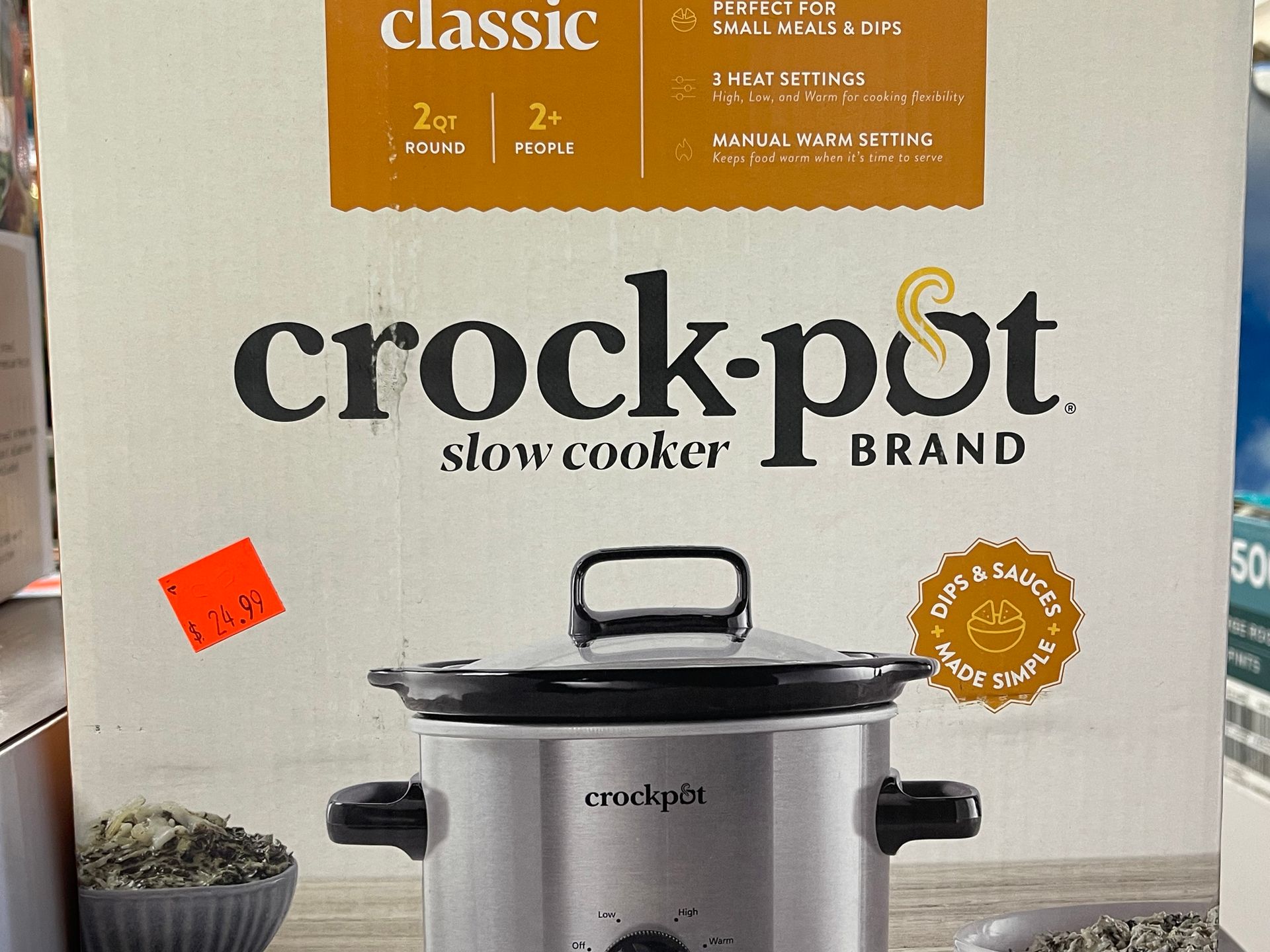 A crock pot brand slow cooker in a box