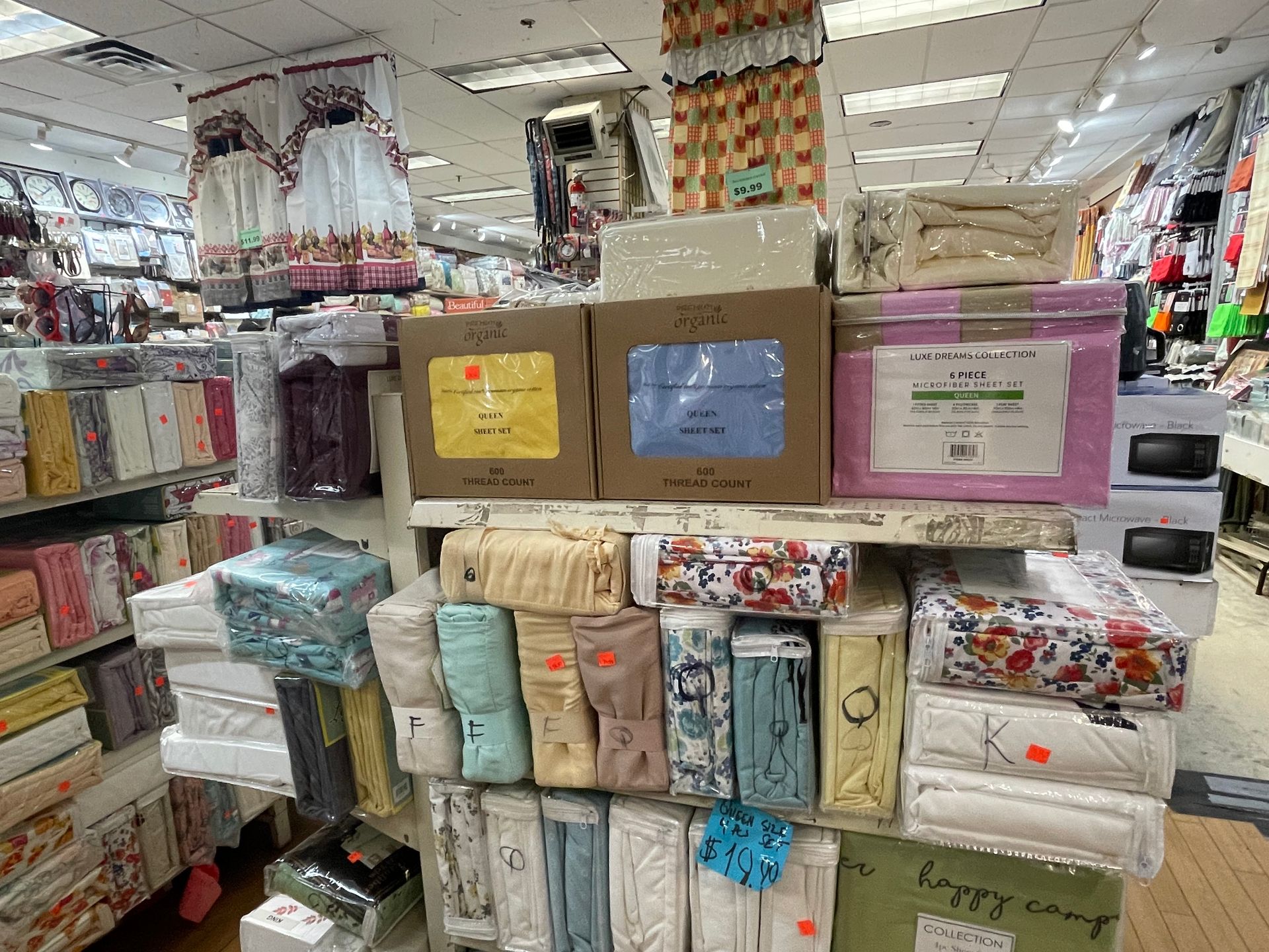A store filled with lots of different types of sheets and towels.