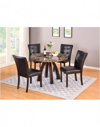 A marble dining table and chairs set in a living room.