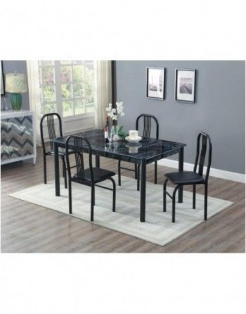 There is a dining table and chairs in the room.