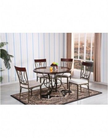 A dining room table and chairs are sitting on a rug in front of a window.