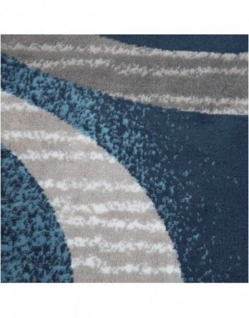 A close up of a blue rug with a pattern on it