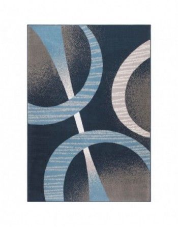 A blue and white rug with a geometric pattern on it