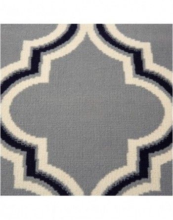 A blue and white rug with a geometric pattern on it.
