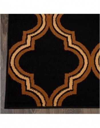 A black and brown rug with a geometric pattern