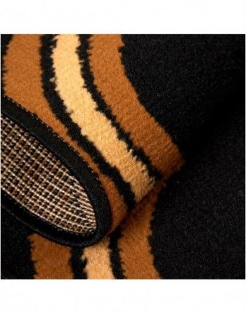 A close up of a black and brown striped rug