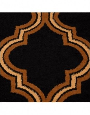 A black and brown rug with a geometric pattern